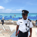 Cops mix and mingle on Seven Mile Beach