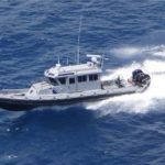 Boat in distress drifts ashore while search underway